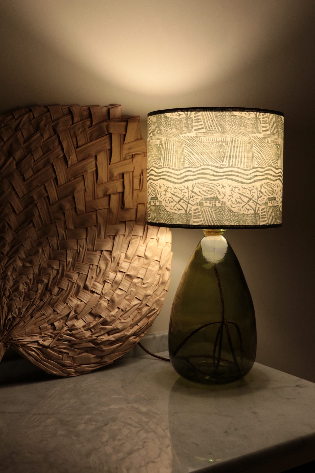 Decorative lamp with textured design on a neutral background